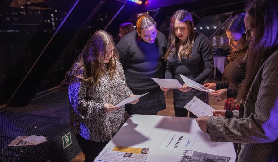 People looking at information about a murder.