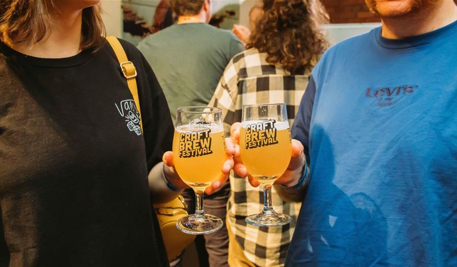 People holding glasses of beer