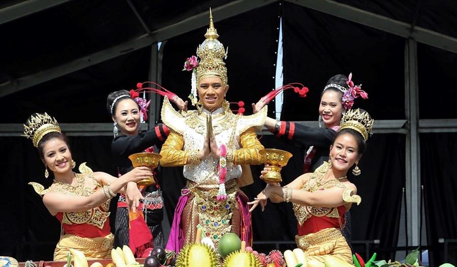 Five people in traditional dress performing at the Southsea Thai Food and Craft Festival