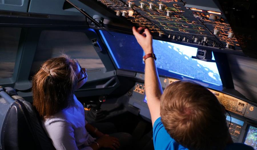 children in aircraft simulator
