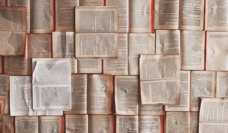 Many open books laid out together