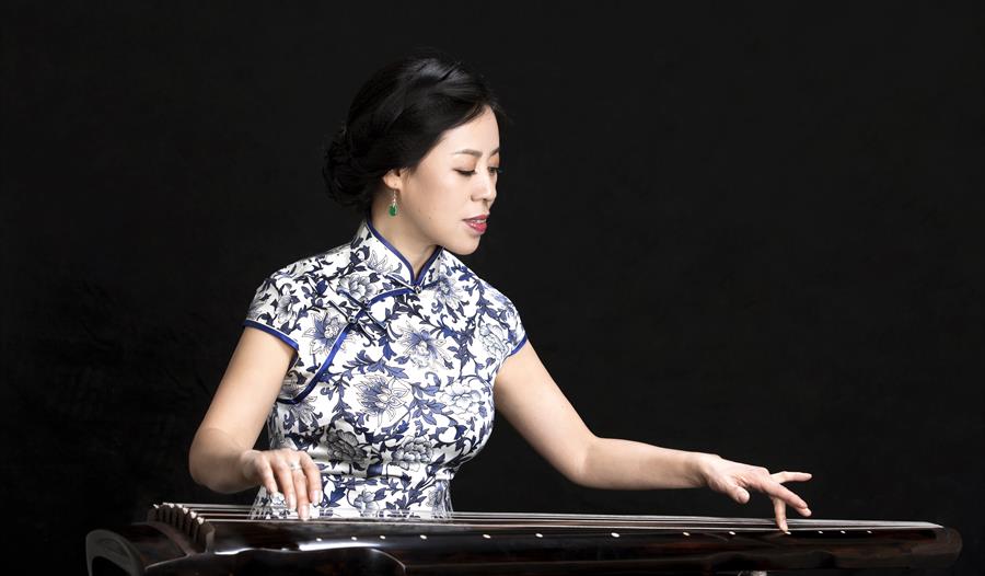 Photo of a woman playing a musical instrument