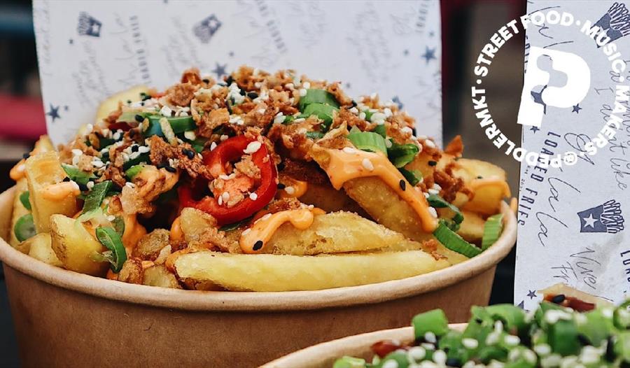 Street food - bowl of chips with various toppings