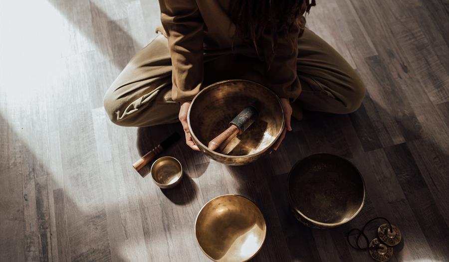 A Person Holding a Tibetan Singing Bowl
