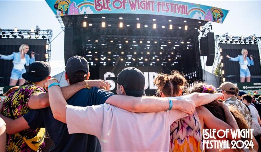 Crowds of people watching an act on the main stage at the Isle of Wight Festival, music, what's on, event