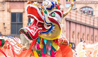 Head of Dragon puppet on Manchester's Dragon Parade