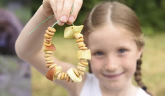 Girl holding bird feeder