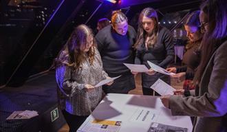 People looking at information about a murder.