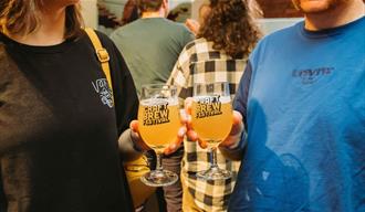 People holding glasses of beer