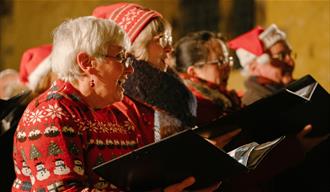 Photo of a line of carolers