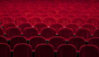 Empty red seats in a theatre