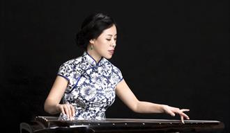 Photo of a woman playing a musical instrument