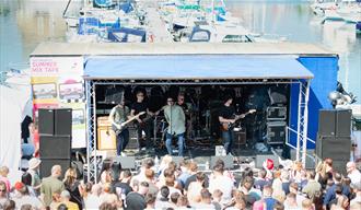 Oasis tribute 'The Supersonics' at a tributes event at Port Solent, playing a stage near the waterfront.