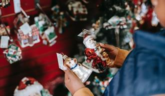 Girl choosing toys for Christmas tree