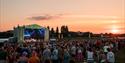 A sunset and stage at Cheltenham Racecourse