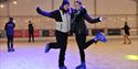 People skating on the ice rink.