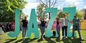 Guests stood with JAZZ sign.