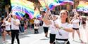 People on Parade with rainbow flags