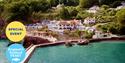 A view looking across the water to Cary Arms & Spa, with the pier in the foreground. Part of England's Seafood FEAST.