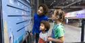 children looking at sign