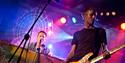 two members of the coldplace band performing on stage