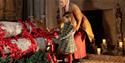 A woman and child inside Hardwick Hall at 'Wintertide'