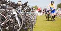Athletes leave the water and run to their waiting bikes to start the 56 mile bike ride.