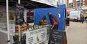 Person at PG Olive Oil stall at Braintree Street Market