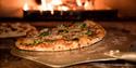 Baked Pizza on Pizza Peel in Oven