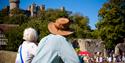 Walkers viewing Arundel Castle from bridge