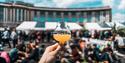 Hand holding beer at Bristol Craft Beer Festival
