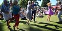 People dancing on the grass