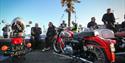 Close up shot of old red motorbike parked up