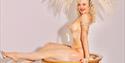 A burlesque dancer in a wine glass