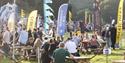 Families sitting outside in the sunshine at Bristol Balloon Fiesta