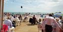Outside of the VIP hospitality area while planes fly above the sea