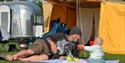 Family playing on rug outside tent at at Wight Buggin', Ryde, Isle of Wight, event, what's on