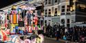 A brightly-coloured illuminated sweets-themed float at the Weston-super-Mare carnival