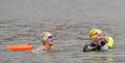 2 people swimming in Bristol Harbour