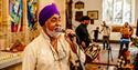 Man singing at Old City Sounds 2024