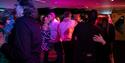 People dancing on City Cruises boat.
