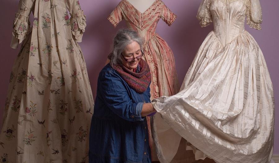 Costume Curator, Shelley, preparing dresses for display