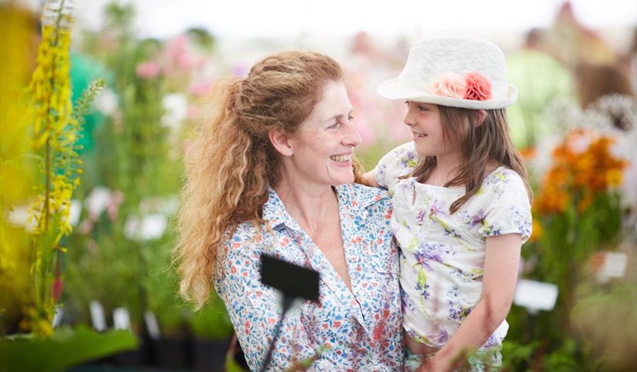 Mother and daughter in a flower show