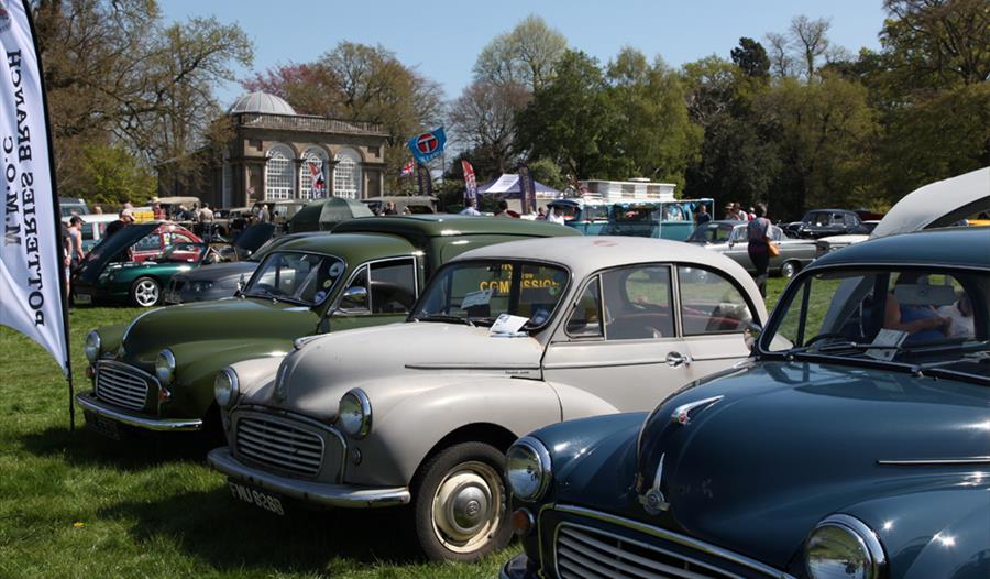 Classic cars on a sunny day at Weston Park, Staffordshire, in front of the beautiful Temple of Diana