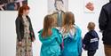 A family group looking at art at Spike Island, Bristol