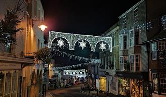 Lyme Regis' Broad Street lit up with Christmas lights