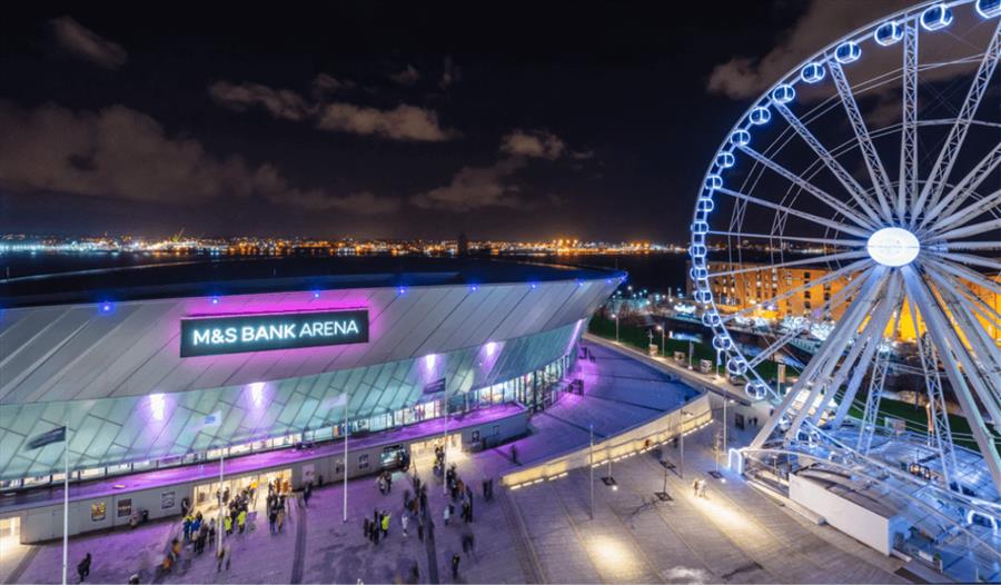 An exterior view of Liverpool's M&S Bank Arena lit up at night