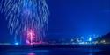 A deep blue firework lights up the skies over Bournemouth Pier