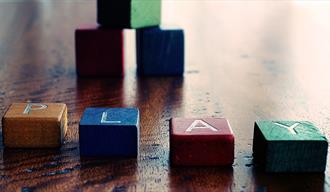 Colourful children's blocks spelling the world play