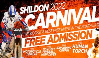 Shildon Carnival - Image shows motorcycle and people doing dangerous stunts against a background of fire.